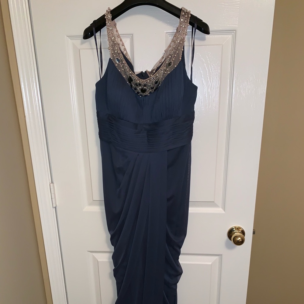 Gorgeous pleated and beaded gown.